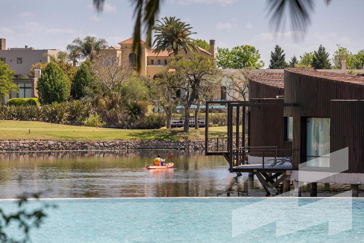 Sofitel La Reserva Cardales Rio Lujan Exterior photo The resort's lake